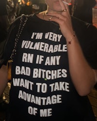 a woman wearing a t - shirt that says i'm very vulnerable if bad bitches want to take advantage of me