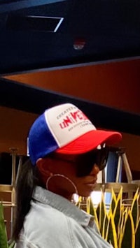 a woman wearing a red, white and blue hat